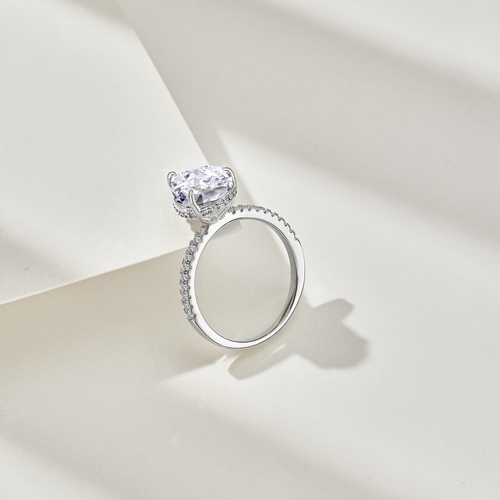 Classic Pear Cut Zirconia on solitaire band half pave Clear