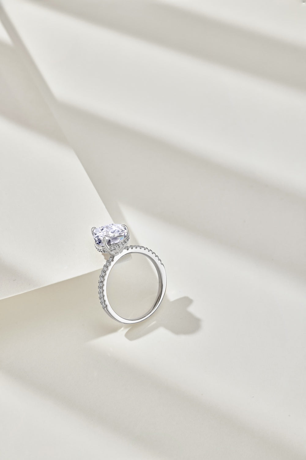 Classic Pear Cut Zirconia on solitaire band half pave Clear
