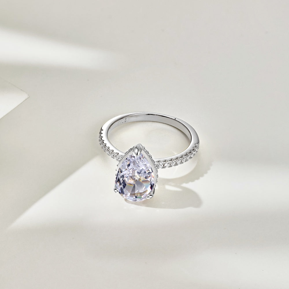 Classic Pear Cut Zirconia on solitaire band half pave Clear