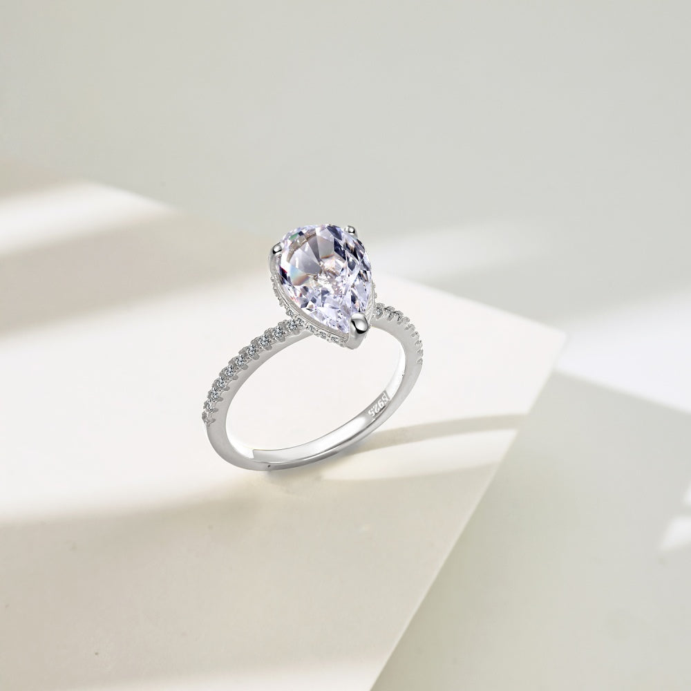 Classic Pear Cut Zirconia on solitaire band half pave Clear