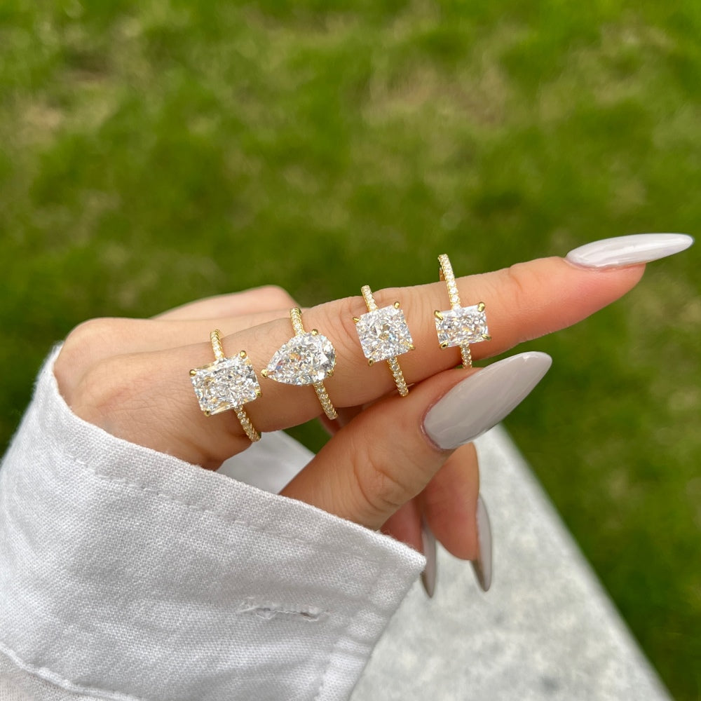 Classic Pear Cut Zirconia on solitaire band half pave gold