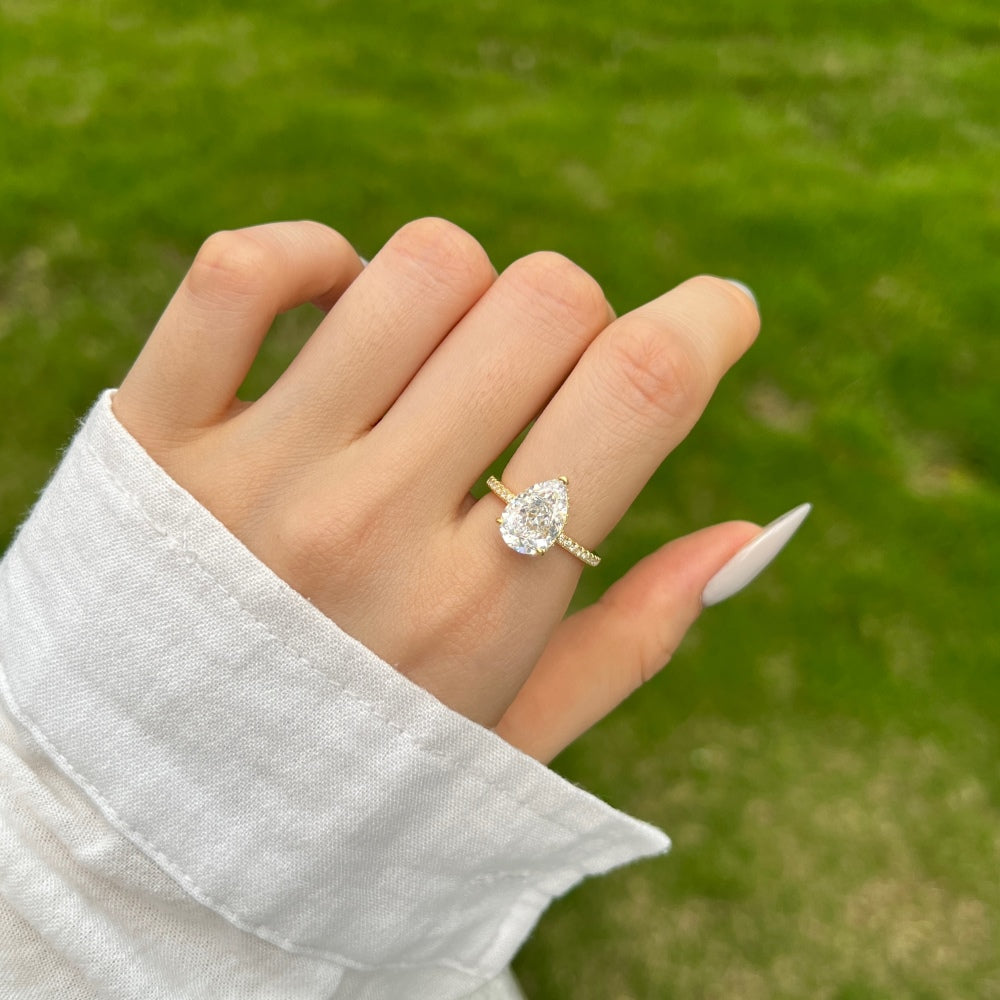 Classic Pear Cut Zirconia on solitaire band half pave gold