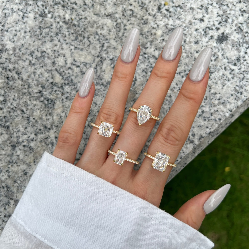 Classic Pear Cut Zirconia on solitaire band half pave gold