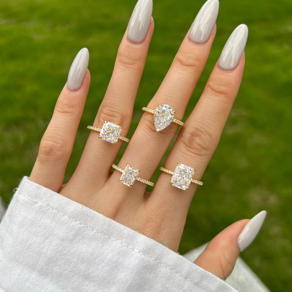 Classic Pear Cut Zirconia on solitaire band half pave gold