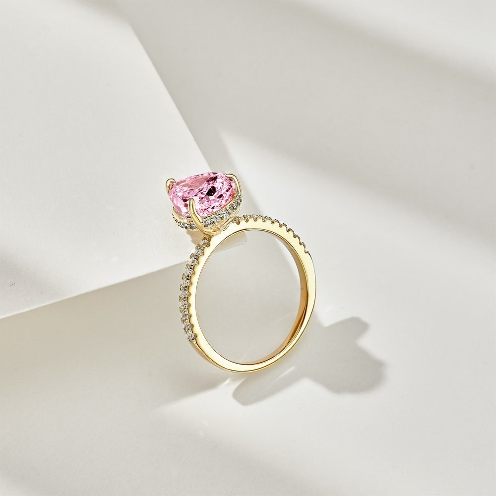 Classic Pear Cut Zirconia on solitaire band half pave gold baby pink