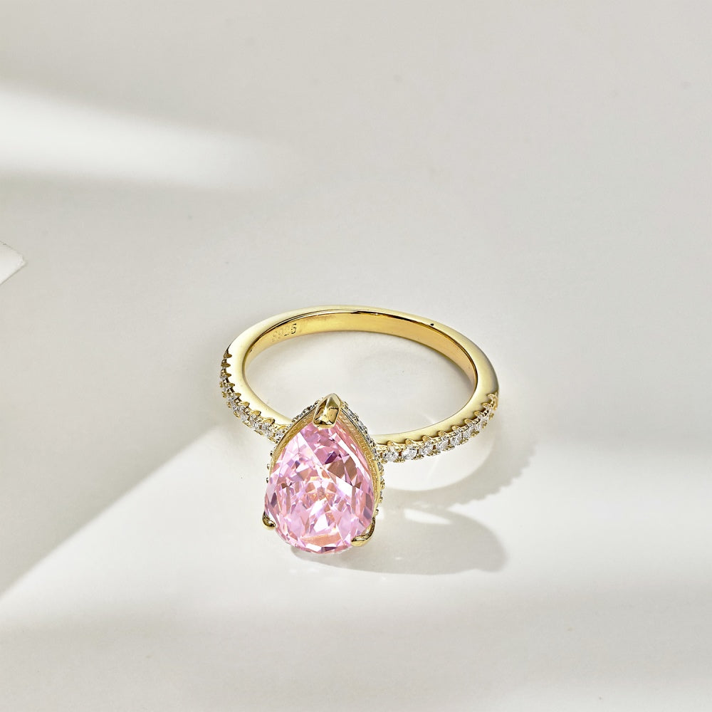 Classic Pear Cut Zirconia on solitaire band half pave gold baby pink