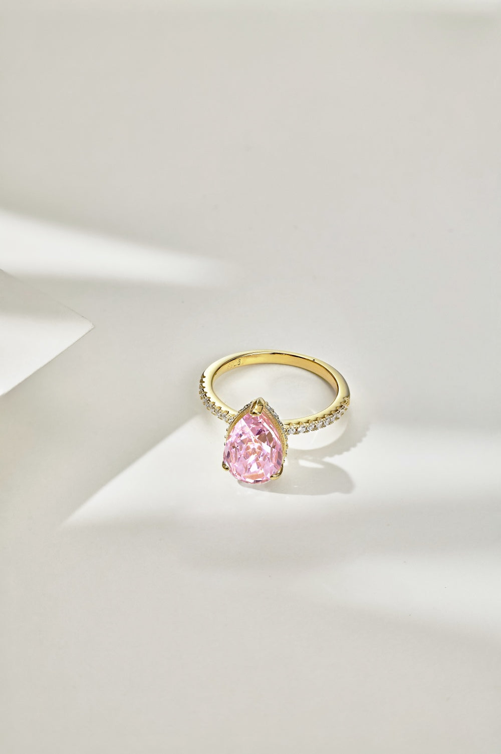 Classic Pear Cut Zirconia on solitaire band half pave gold baby pink