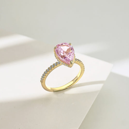 Classic Pear Cut Zirconia on solitaire band half pave gold baby pink