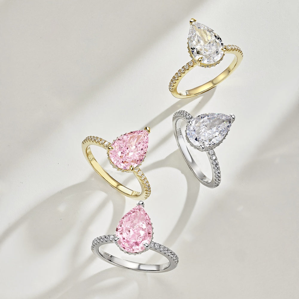 Classic Pear Cut Zirconia on solitaire band half pave gold baby pink