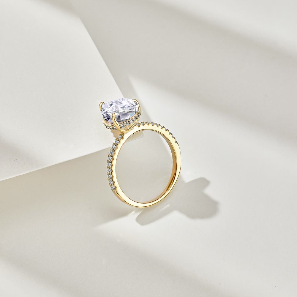 Classic Pear Cut Zirconia on solitaire band half pave gold