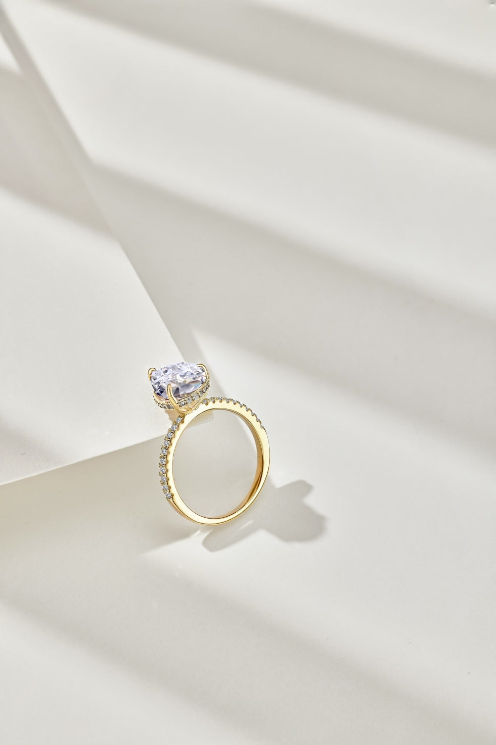 Classic Pear Cut Zirconia on solitaire band half pave gold