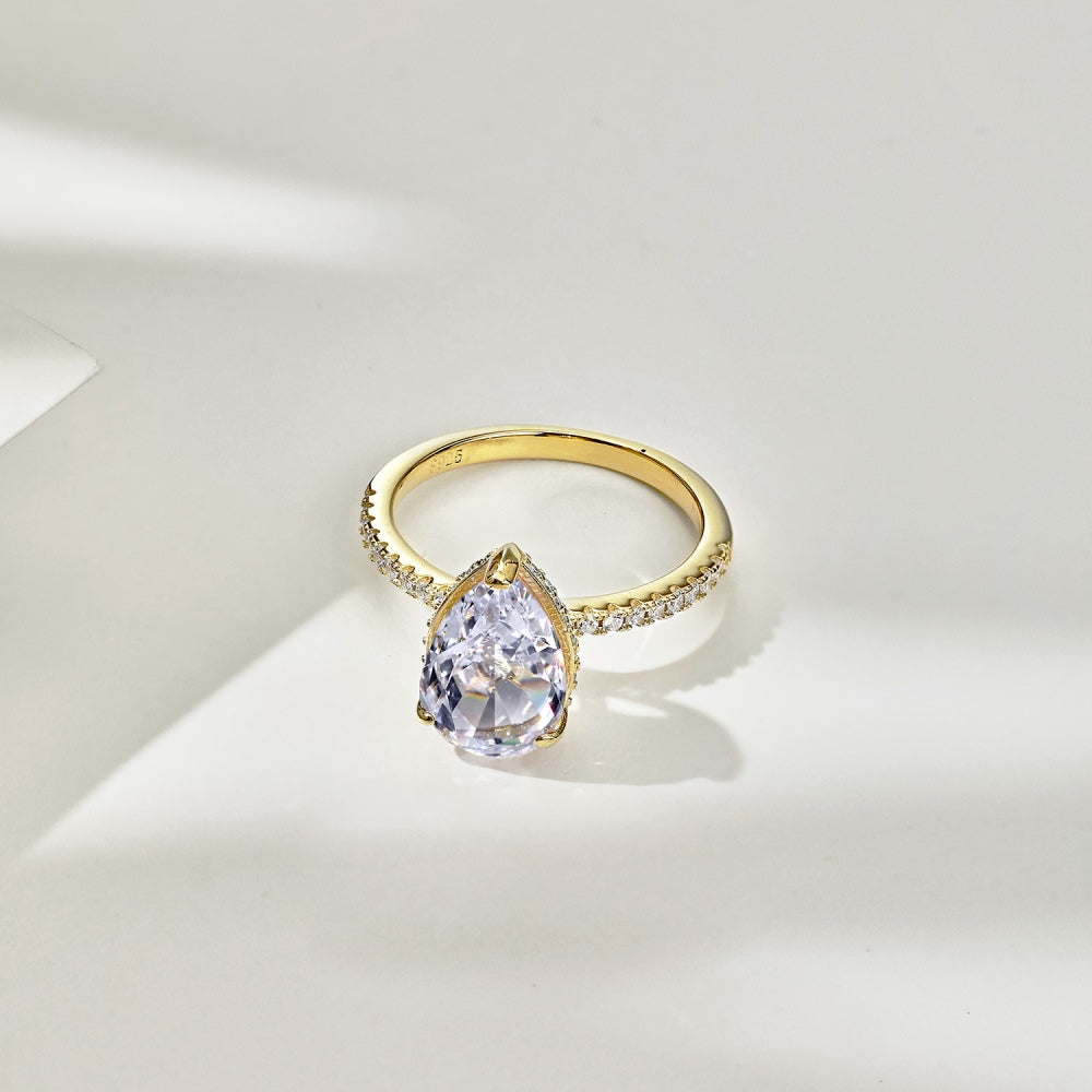 Classic Pear Cut Zirconia on solitaire band half pave gold