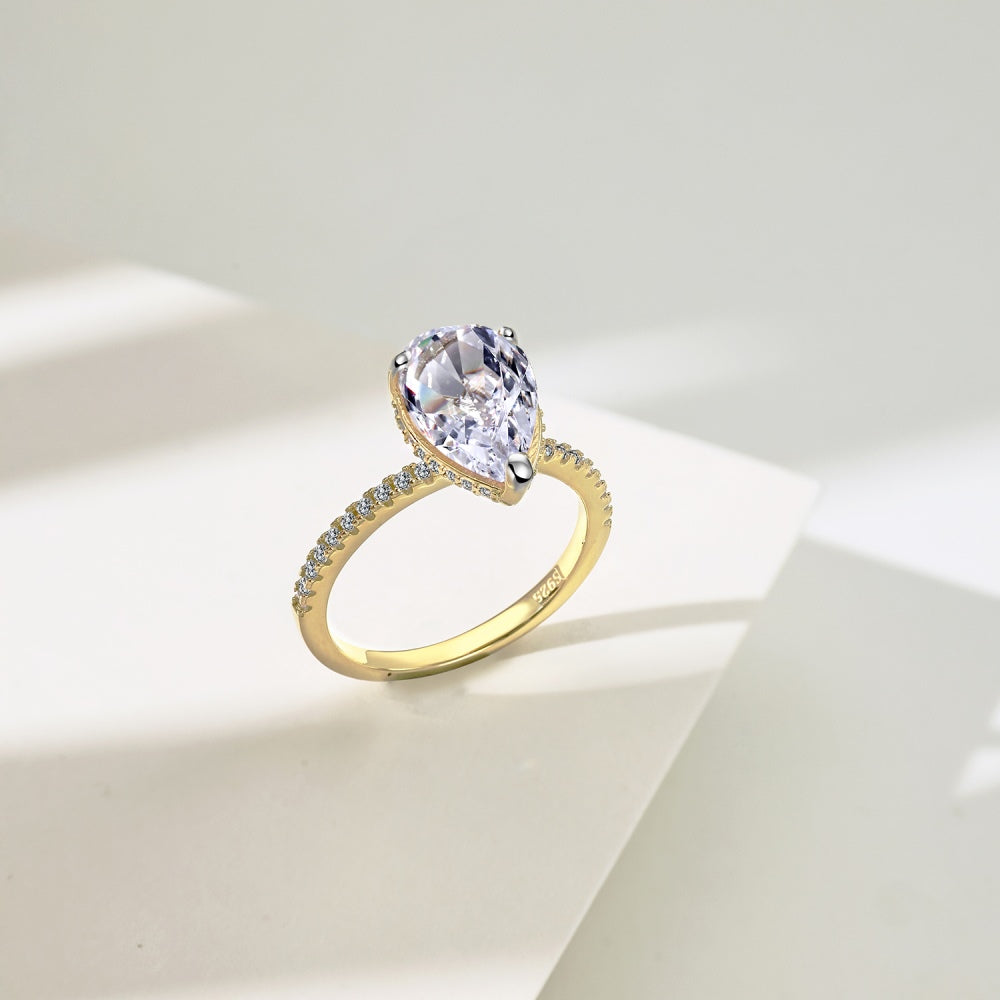 Classic Pear Cut Zirconia on solitaire band half pave gold