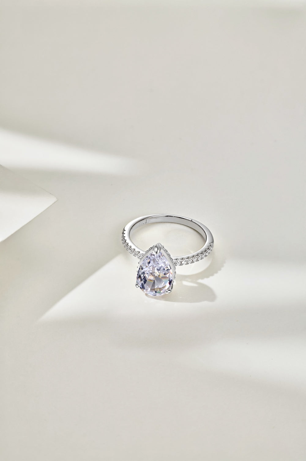 Classic Pear Cut Zirconia on solitaire band half pave Clear