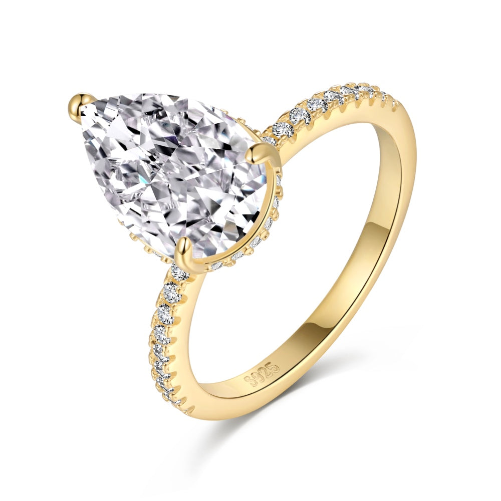 Classic Pear Cut Zirconia on solitaire band half pave gold