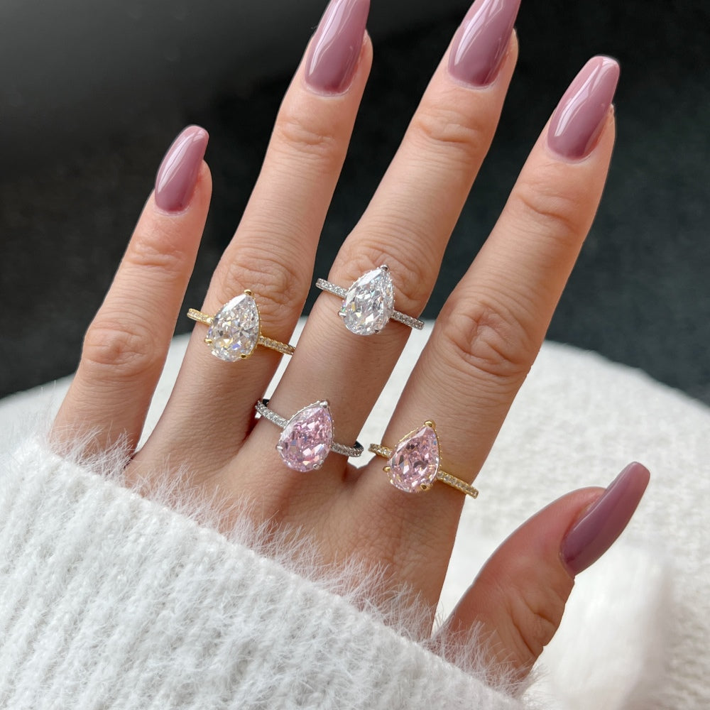 Classic Pear Cut Zirconia on solitaire band half pave gold baby pink