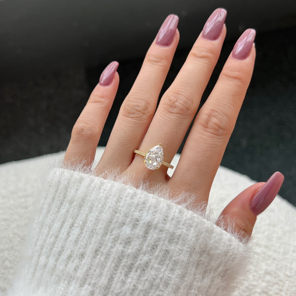 Classic Pear Cut Zirconia on solitaire band half pave gold