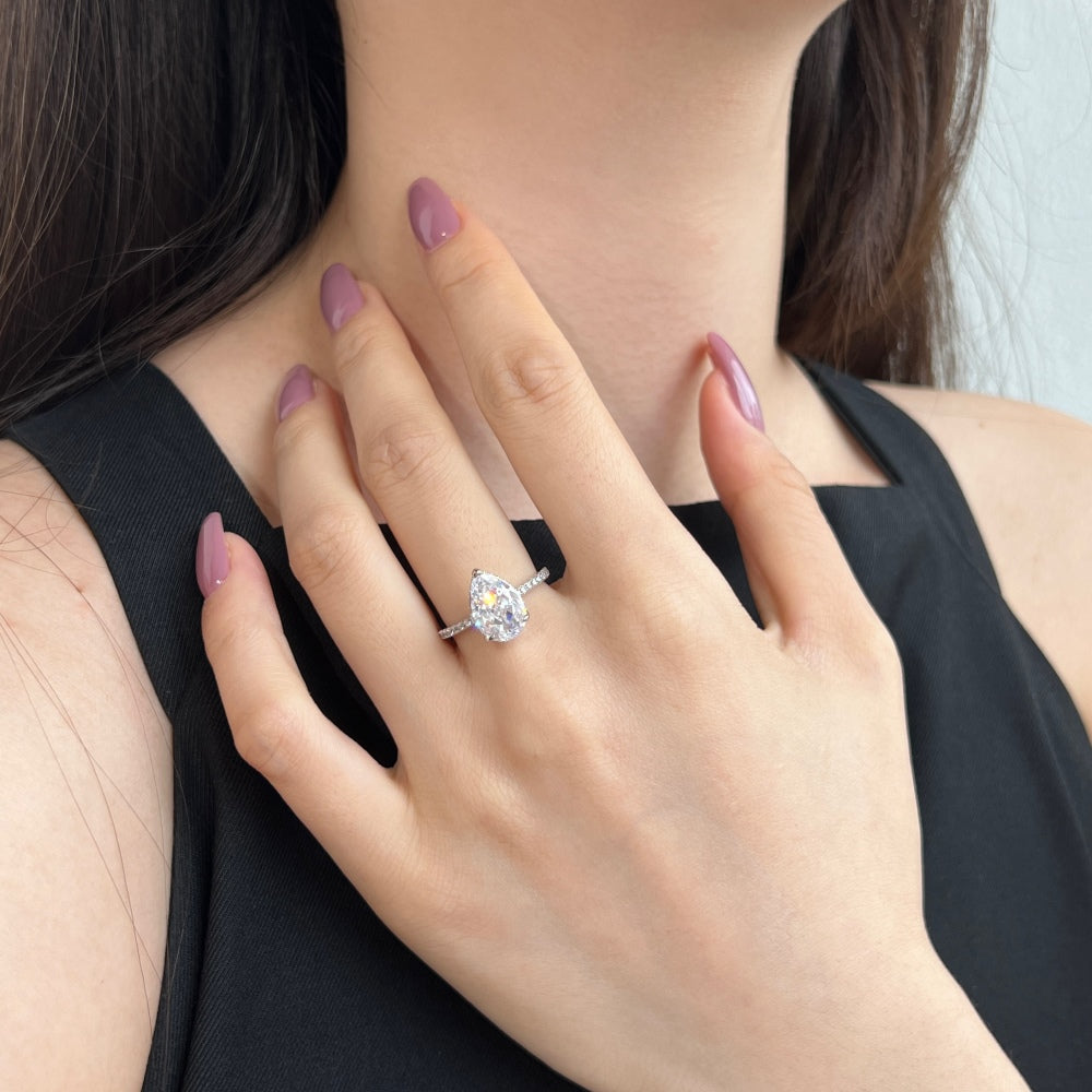 Classic Pear Cut Zirconia on solitaire band half pave gold