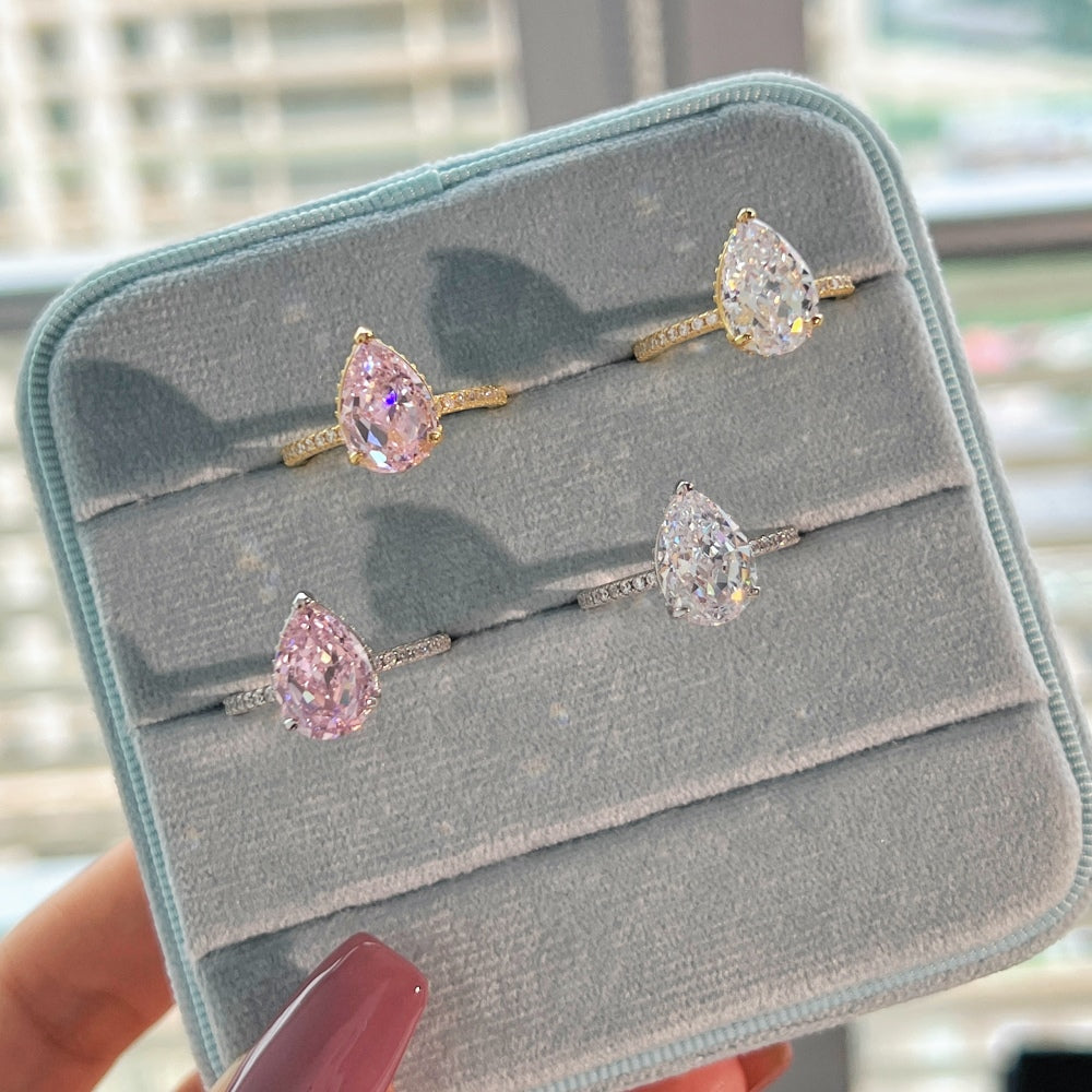 Classic Pear Cut Zirconia on solitaire band half pave gold baby pink