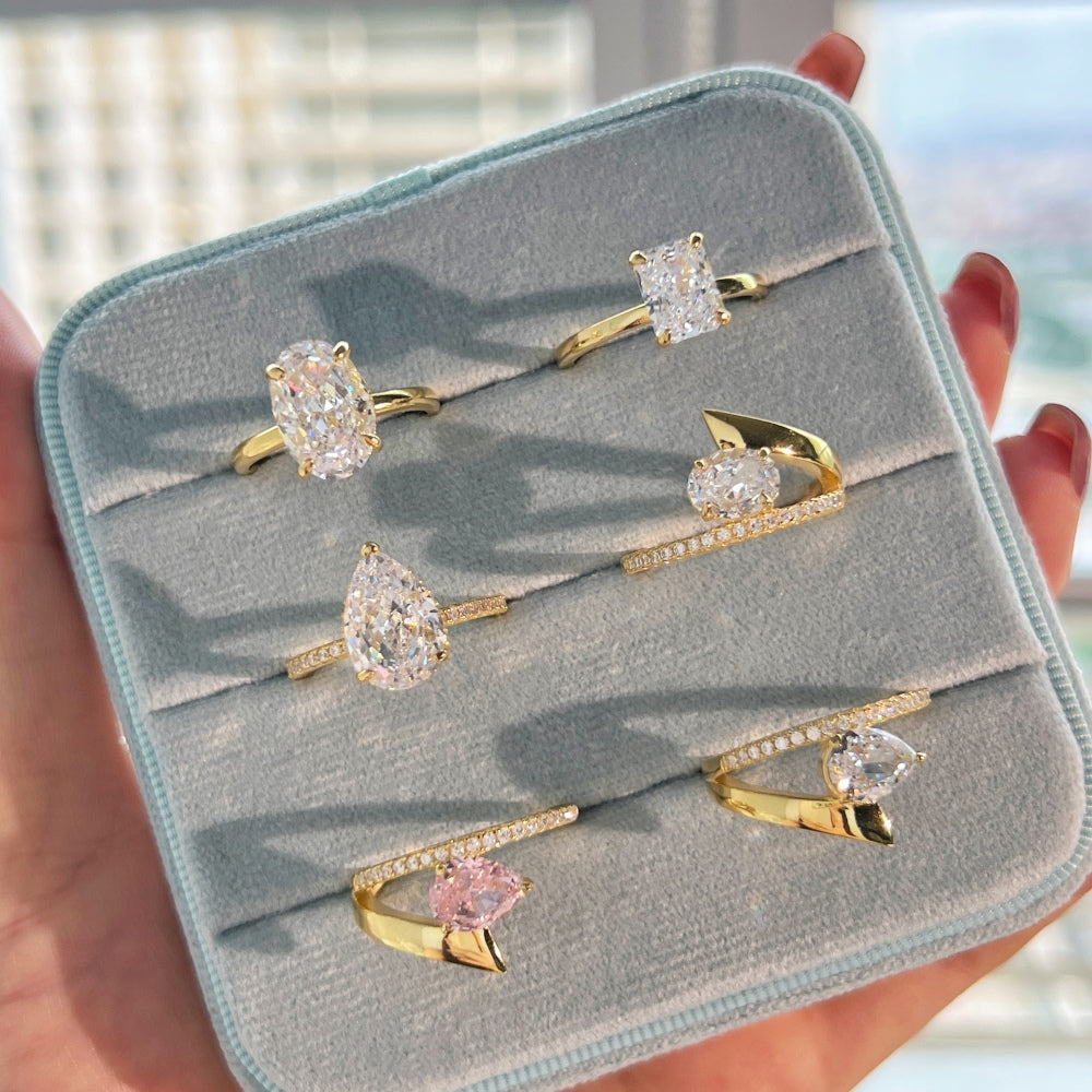 Classic Pear Cut Zirconia on solitaire band half pave gold